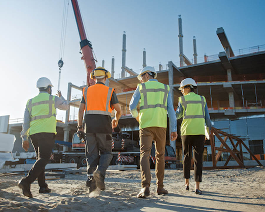 Diverse Team of Specialists Inspect Commercial, Industrial Build
